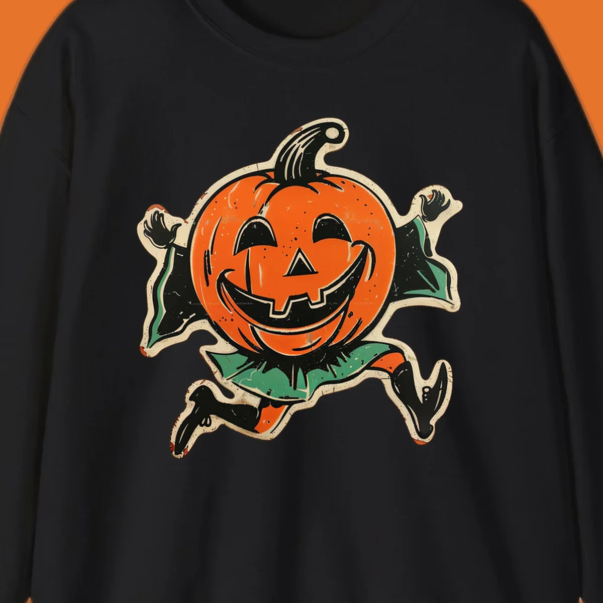 Vintage running jack-o'-lantern graphic with a big smile, black boots, and green leaves.