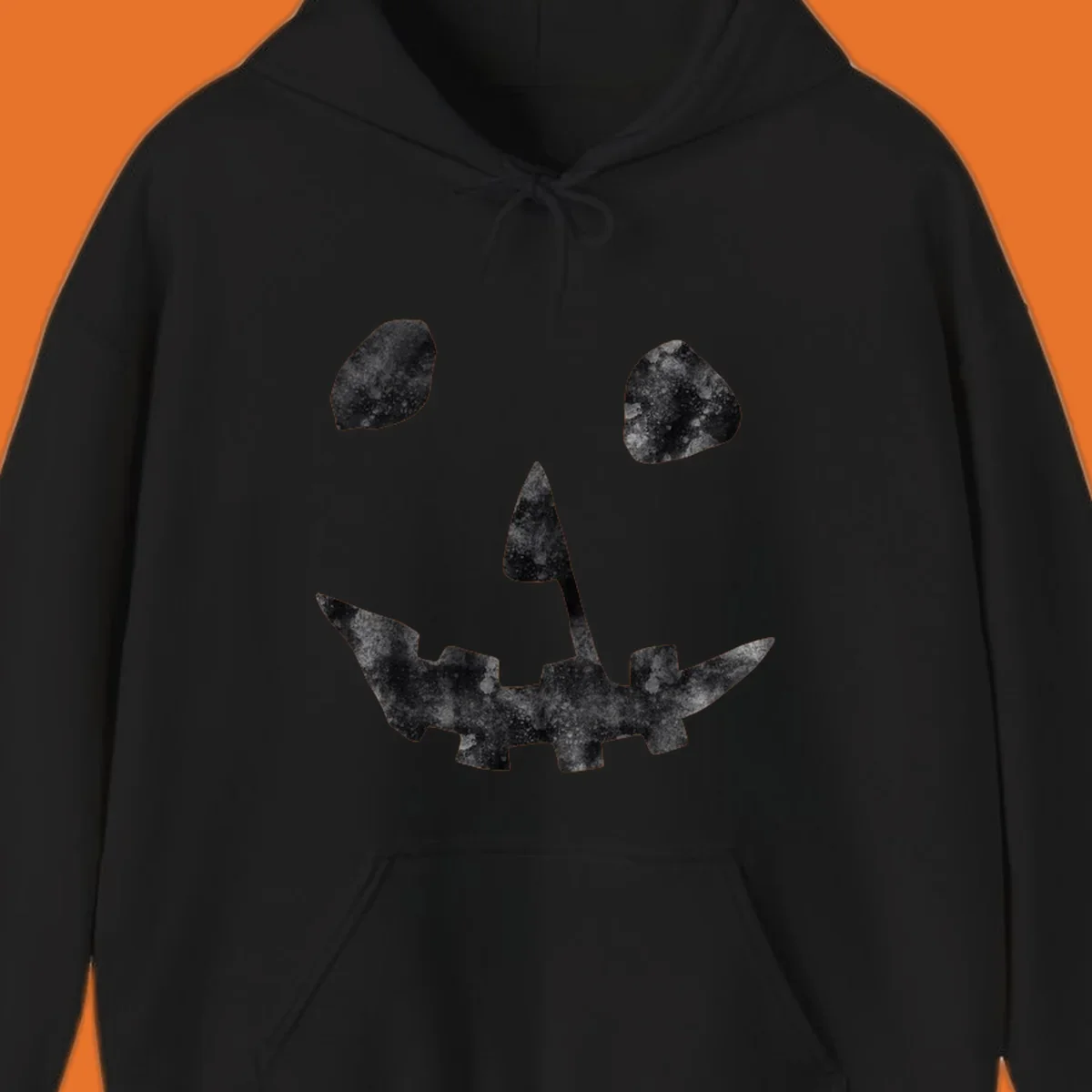 Spooky jack o lantern face graphic with distressed texture for Halloween.