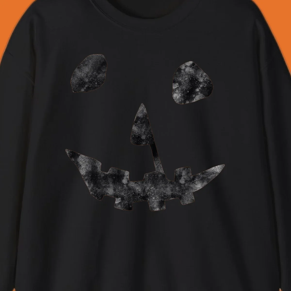 Spooky jack o lantern face graphic with distressed texture for Halloween.