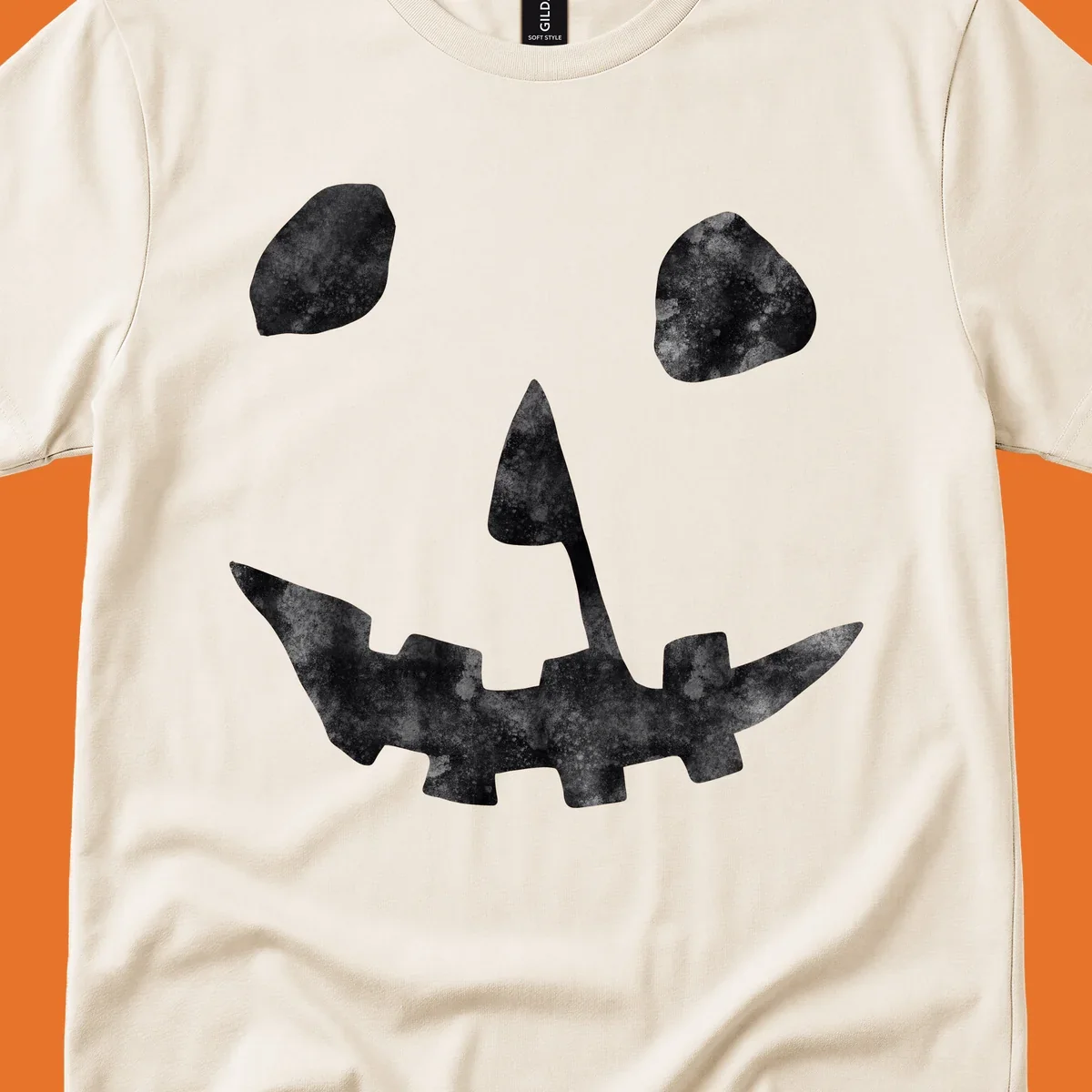 Spooky jack o lantern face graphic with distressed texture for Halloween.
