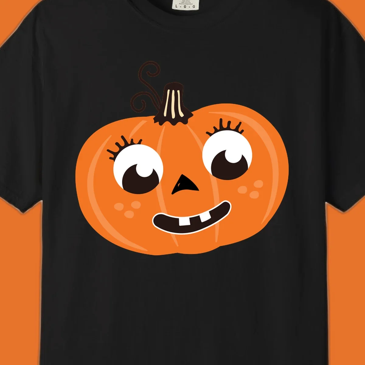 Cute halloween pumpkin face graphic with big eyes and a smile.