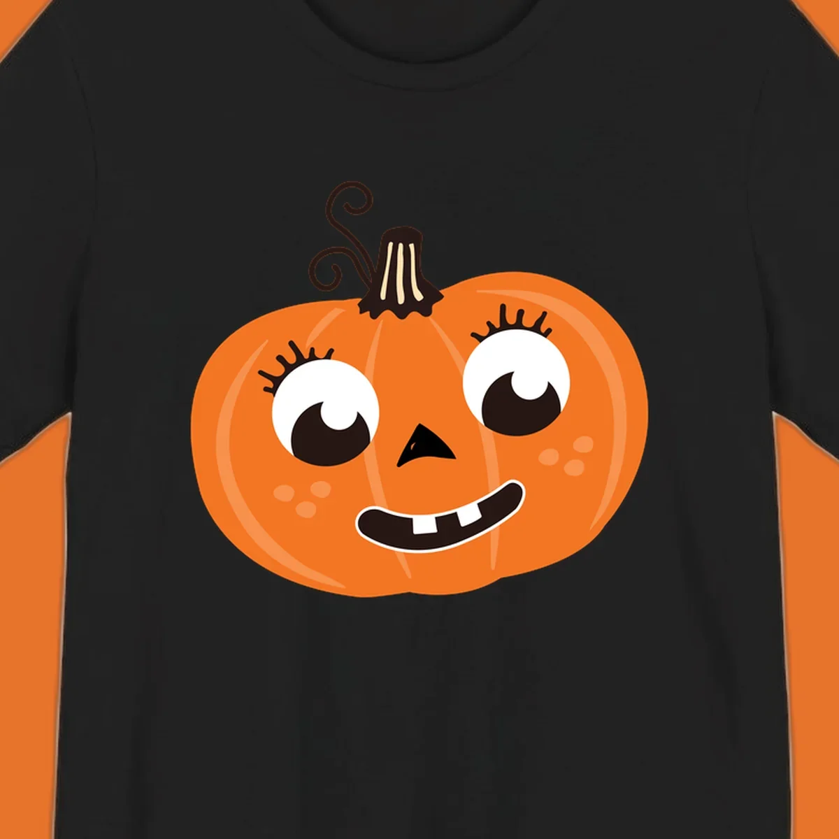 Cute halloween pumpkin face graphic with big eyes and a smile.