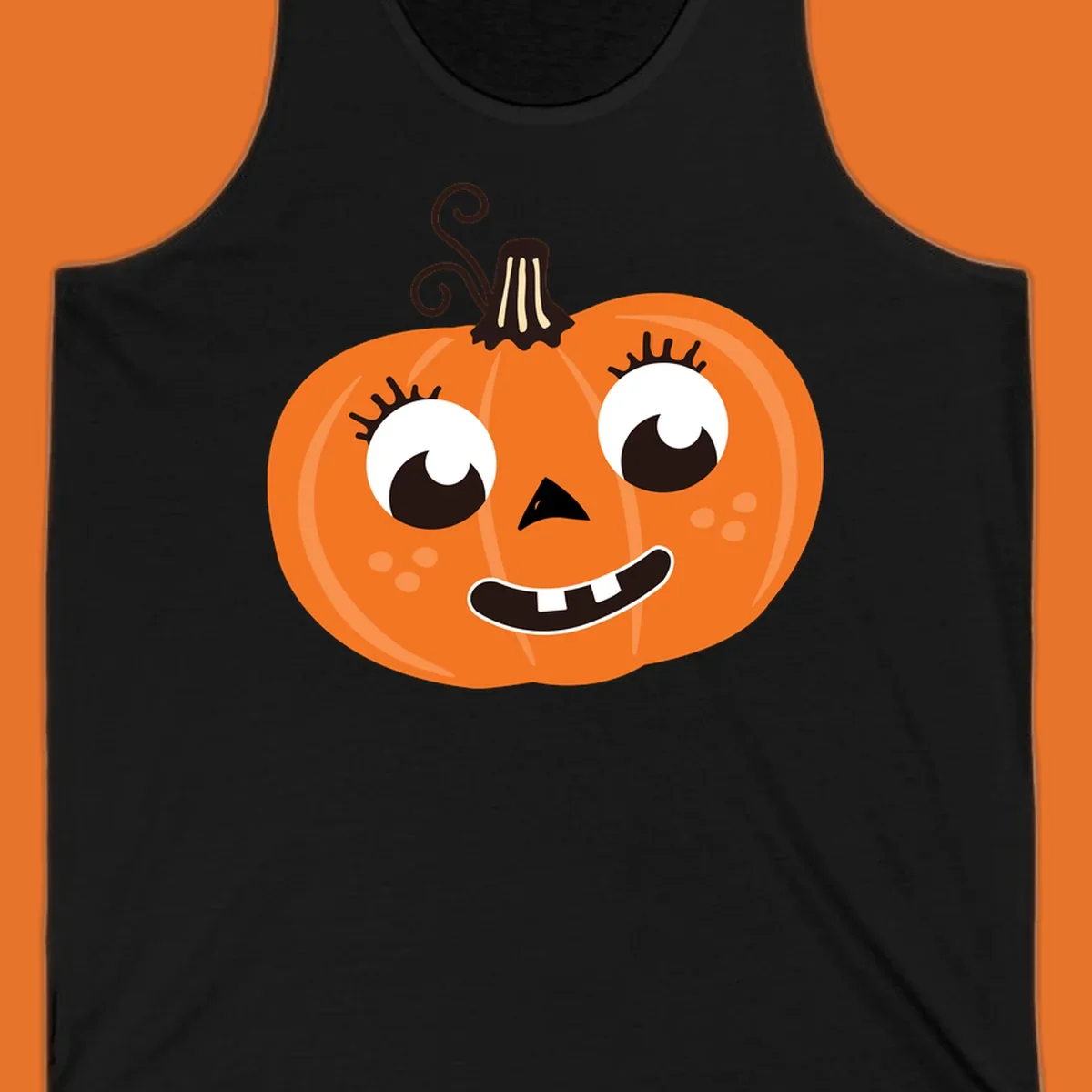 Cute halloween pumpkin face graphic with big eyes and a smile.