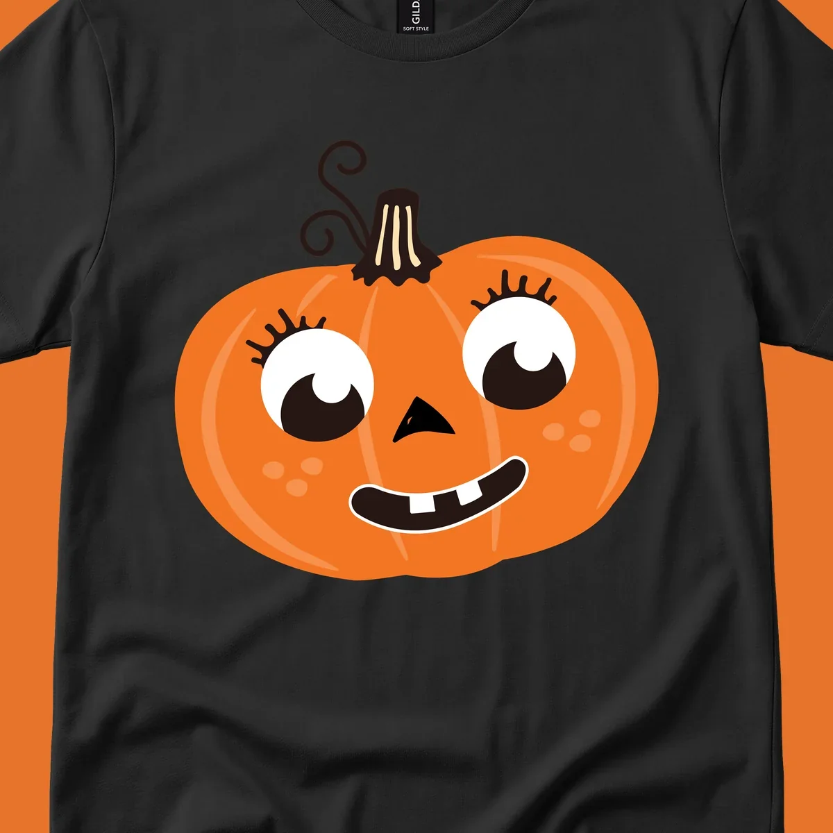 Cute halloween pumpkin face graphic with big eyes and a smile.