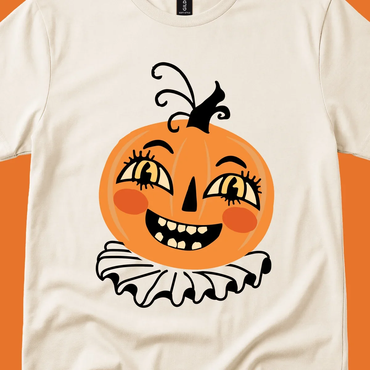 Happy jack o lantern illustration with a big smile and rosy cheeks, wearing a ruffled collar, for Halloween.