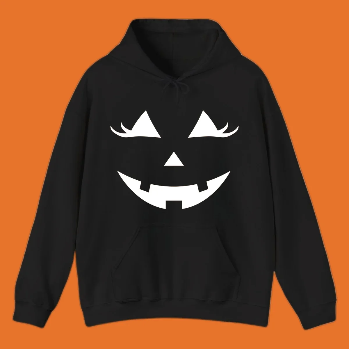 Spooky grinning jack-o-lantern face with triangle eyes and jagged smile, graphic for halloween.