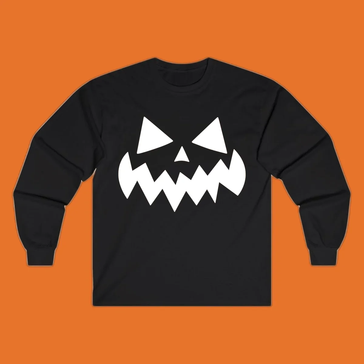 Spooky jack-o-lantern face with triangular eyes and a jagged mouth graphic.