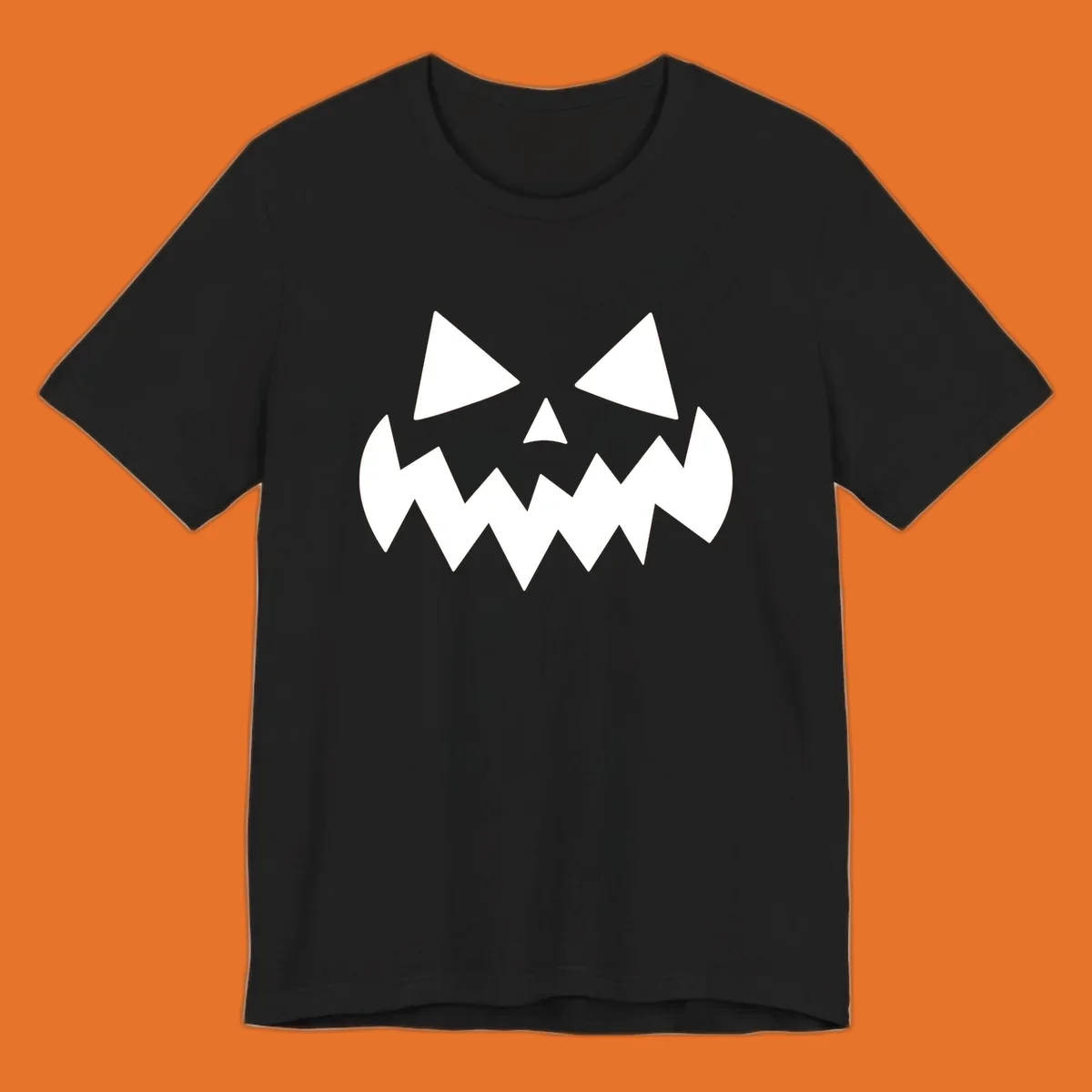 Spooky jack-o-lantern face with triangular eyes and a jagged mouth graphic.