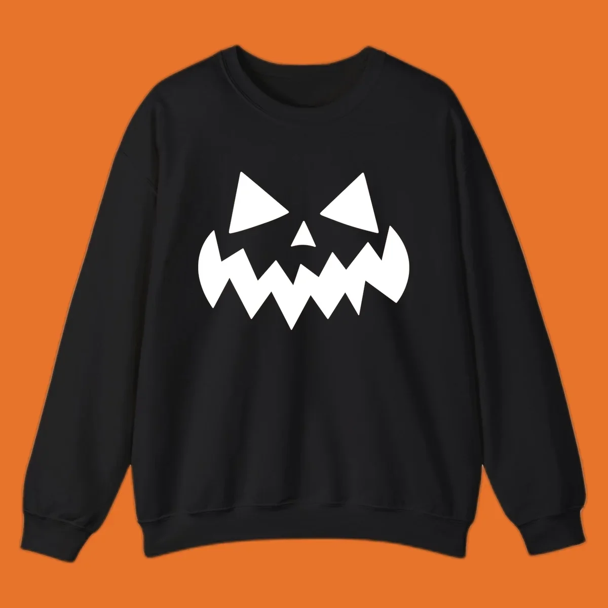 Spooky jack-o-lantern face with triangular eyes and a jagged mouth graphic.