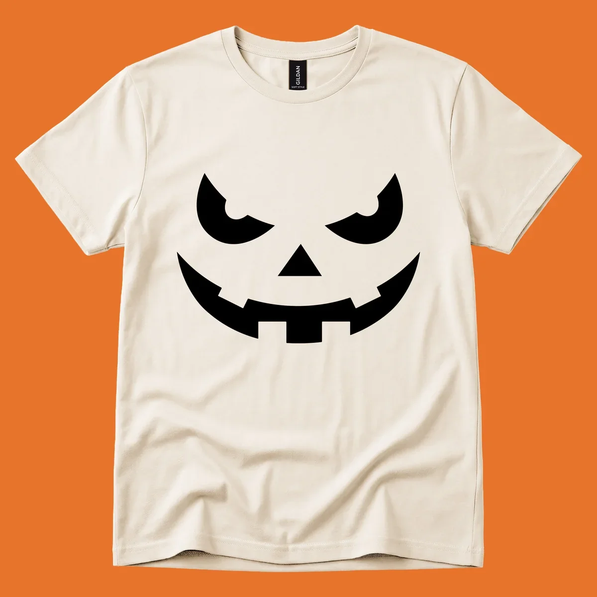 Spooky pumpkin face graphic with sharp eyes and a jagged grin.