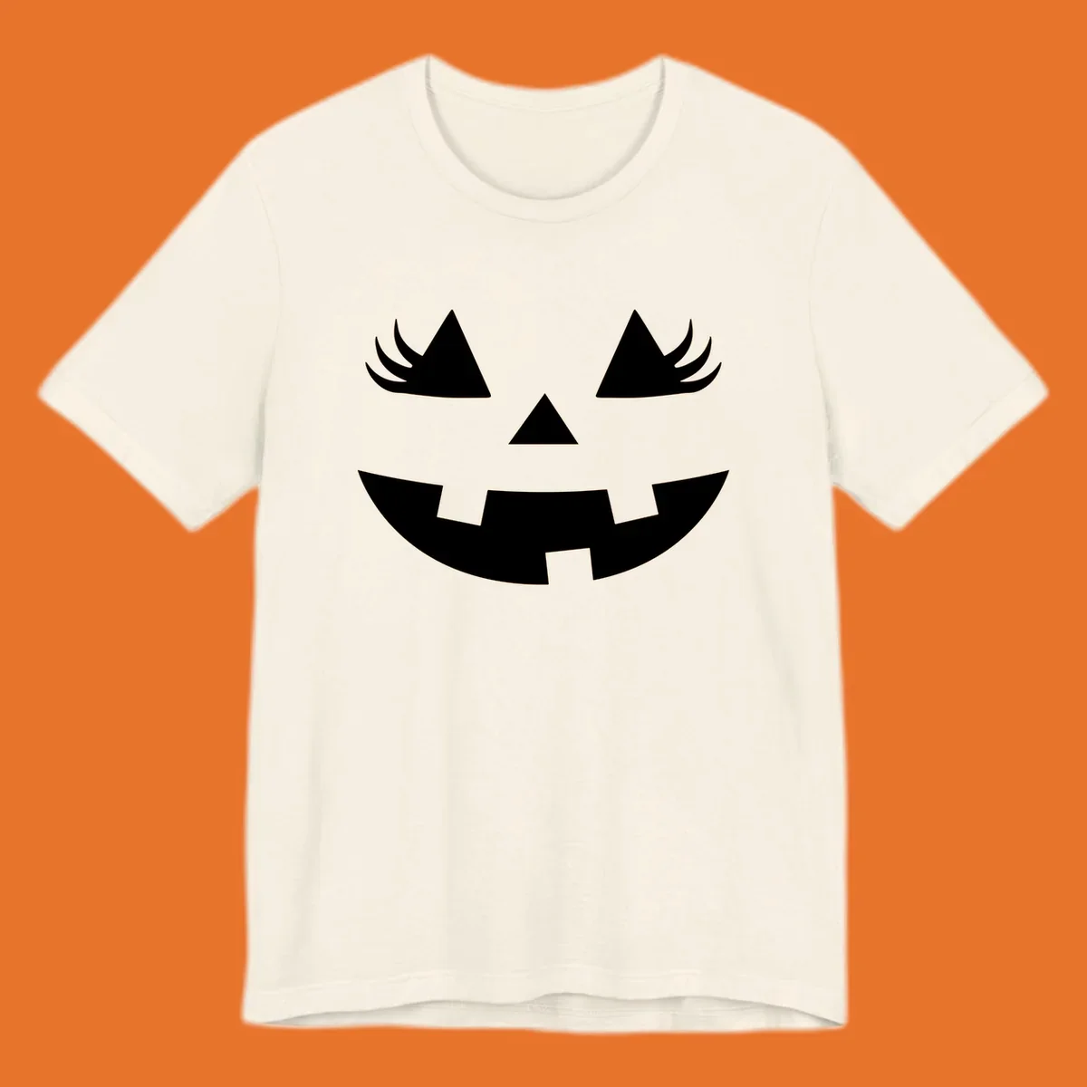 Jack o' lantern face with triangle eyes, nose, and jagged smile, featuring eyelashes.