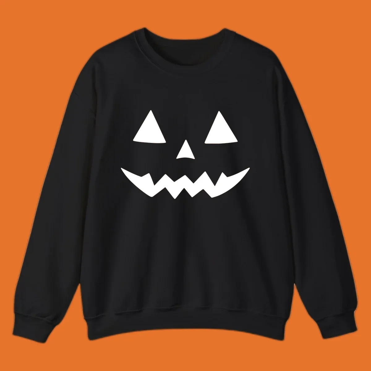 Classic jack-o-lantern face with triangle eyes and jagged mouth graphic.