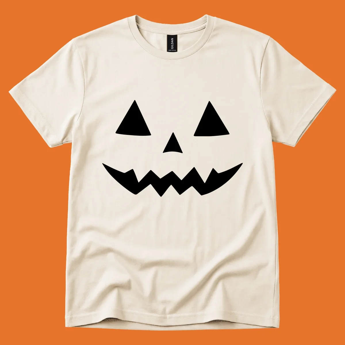 Classic jack-o-lantern face with triangle eyes and jagged mouth graphic.
