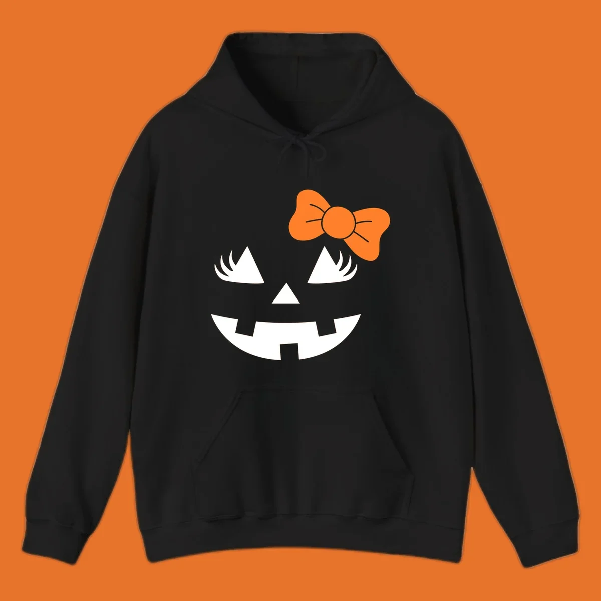 Cute halloween pumpkin face with an orange bow graphic