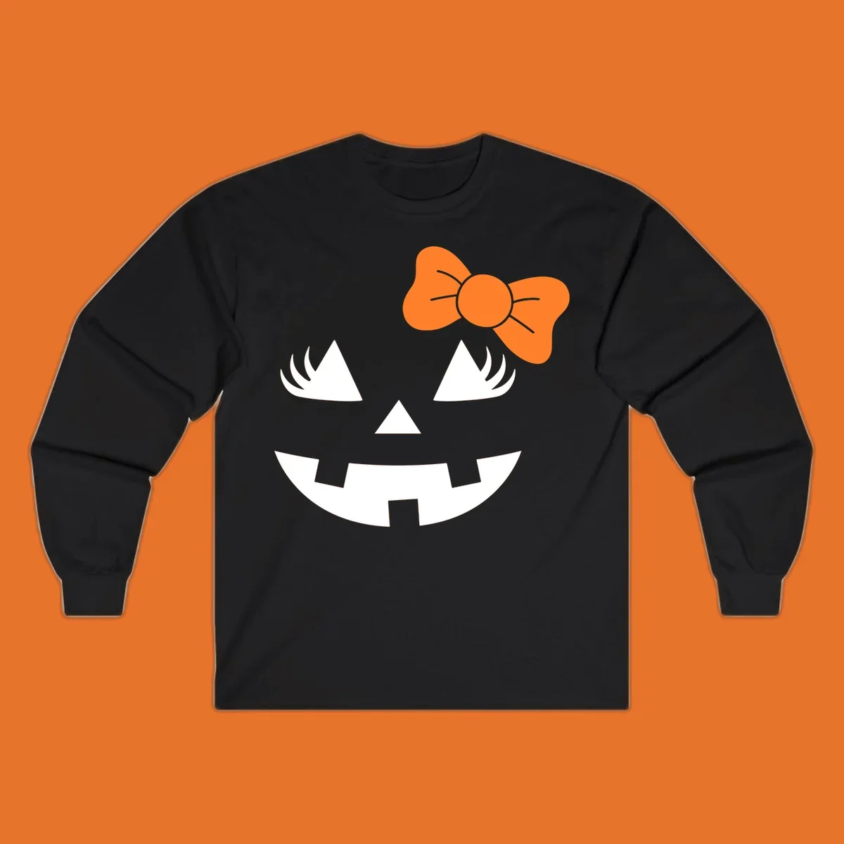 Cute halloween pumpkin face with an orange bow graphic