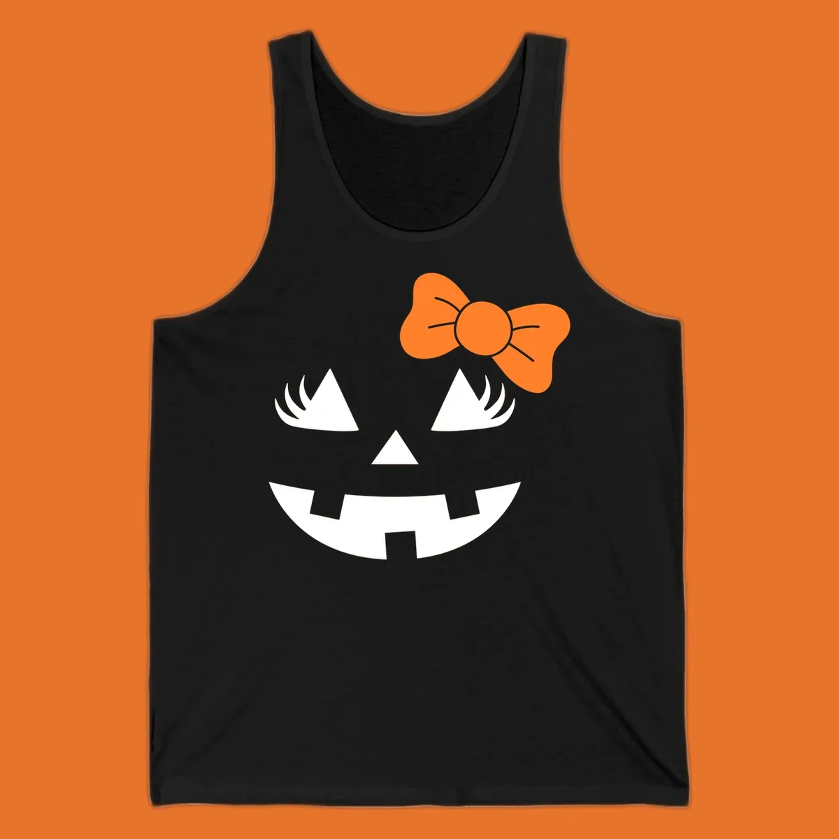 Cute halloween pumpkin face with an orange bow graphic