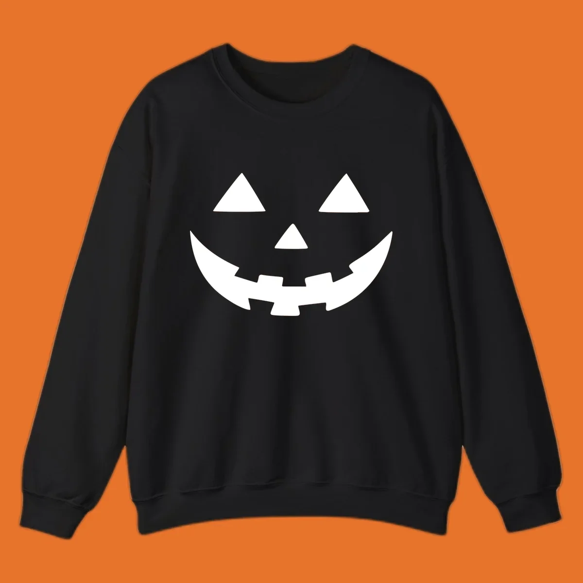 Classic jack o lantern face graphic with triangle eyes and jagged smile.