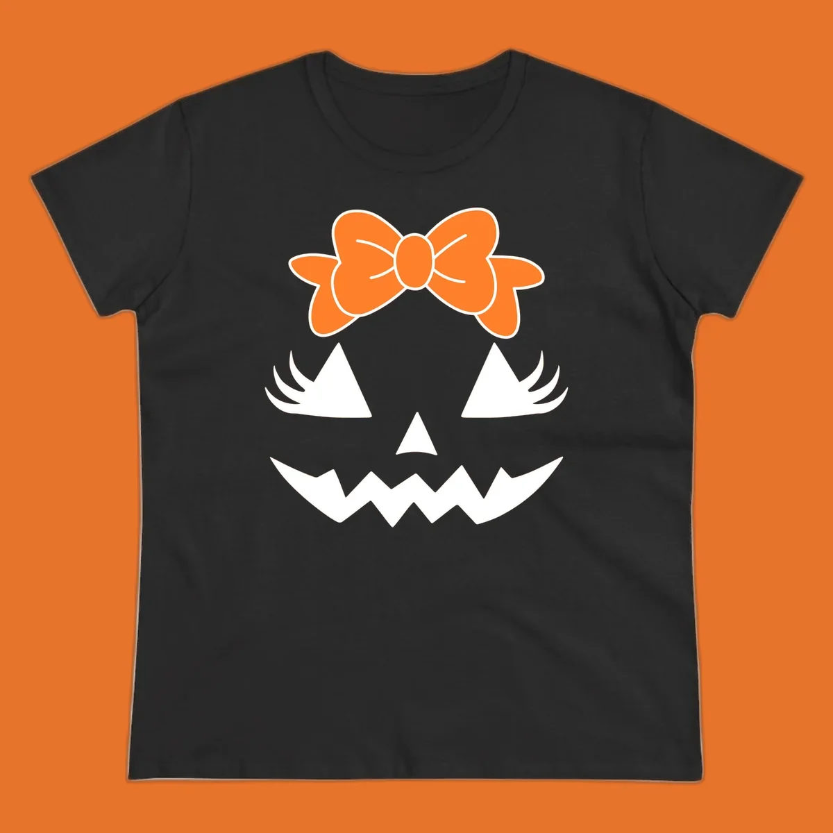 Cute pumpkin face graphic with orange bow, triangle eyes, nose, and jagged smile.