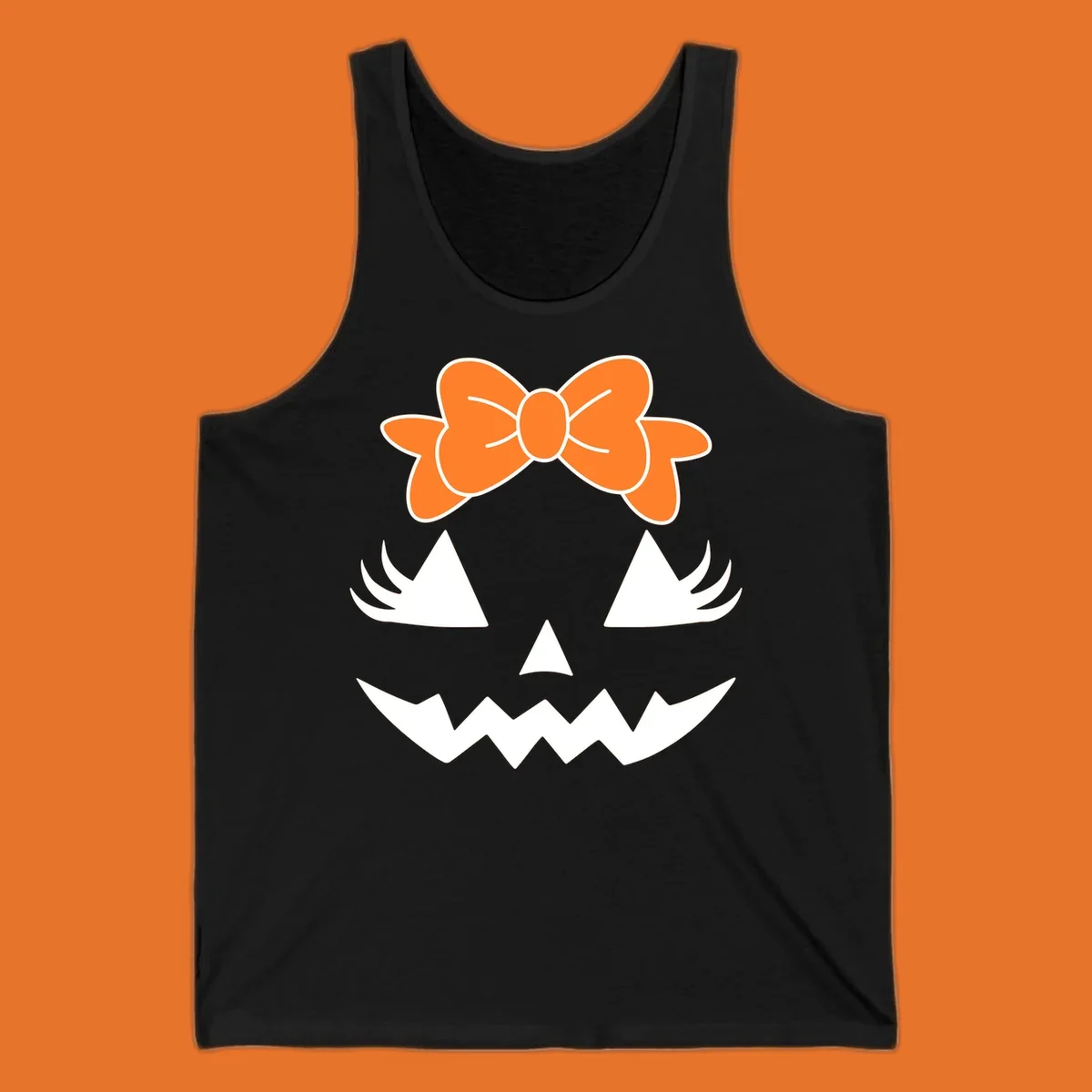 Cute pumpkin face graphic with orange bow, triangle eyes, nose, and jagged smile.