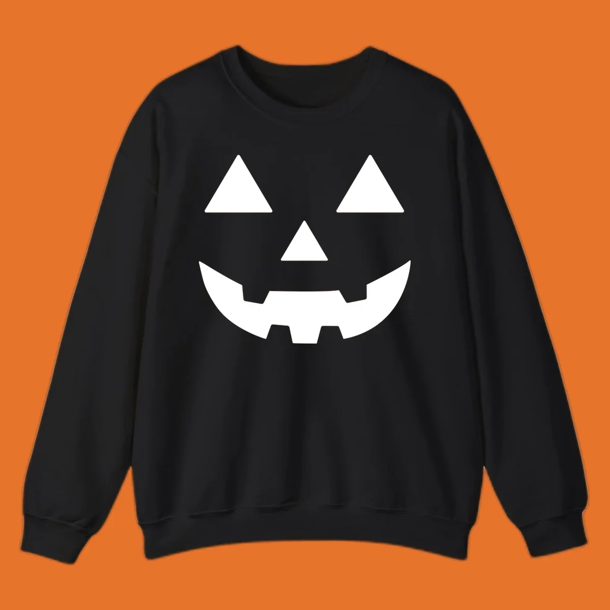 Classic Jack O' Lantern face with triangle eyes, nose, and jagged smile, rendered in white on black and black on white.