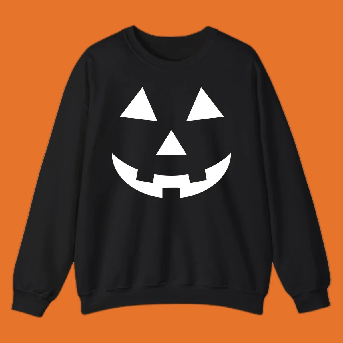 Classic jack o lantern face graphic with triangle eyes and jagged smile. Halloween design.