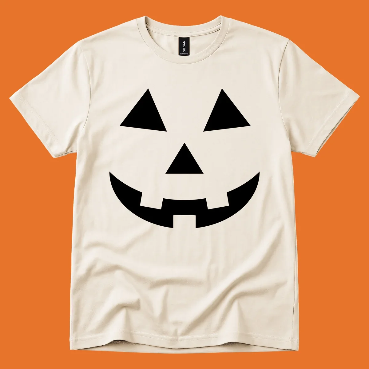 Classic jack o lantern face graphic with triangle eyes and jagged smile. Halloween design.