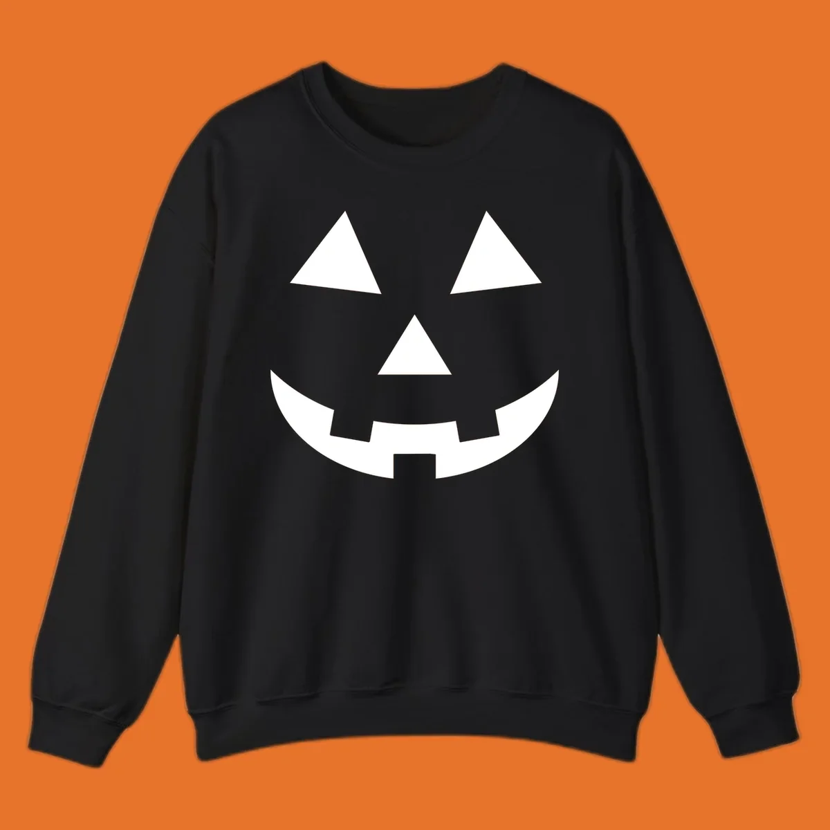 Classic jack-o-lantern face with triangle eyes and jagged smile. Halloween graphic.