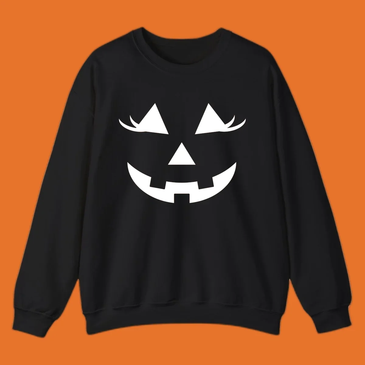 Jack o lantern face with triangular eyes and a jagged smile, classic halloween graphic.