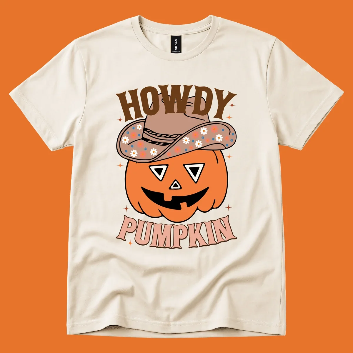 Howdy Pumpkin cowboy hat illustration for Halloween, with retro-style text and floral accents.