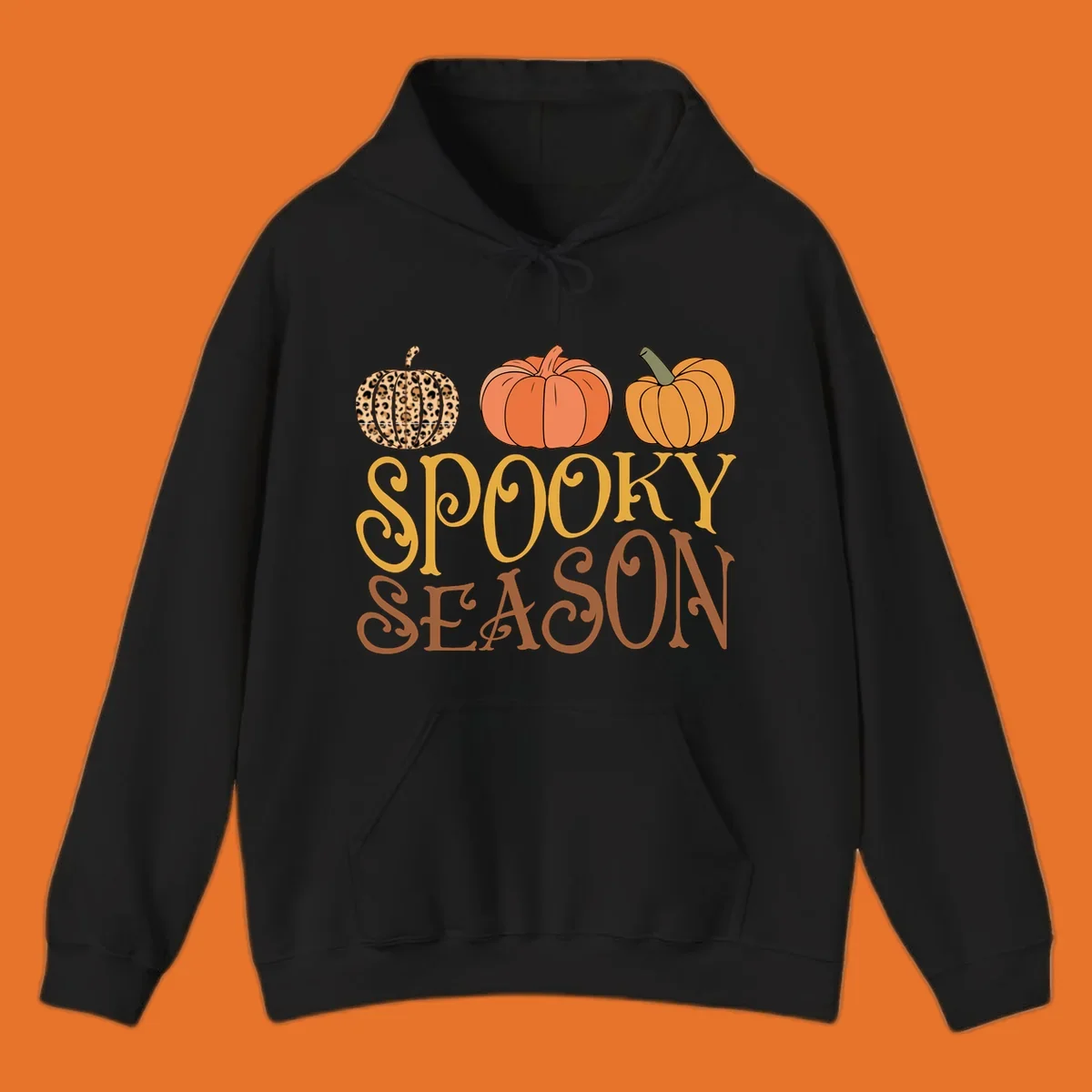 Spooky season pumpkins with leopard print and skull design, text: SPOOKY SEASON.