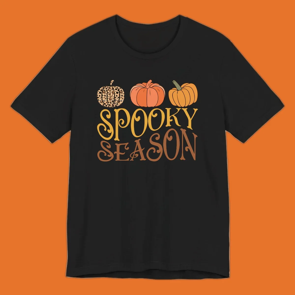 Spooky season pumpkins with leopard print and skull design, text: SPOOKY SEASON.