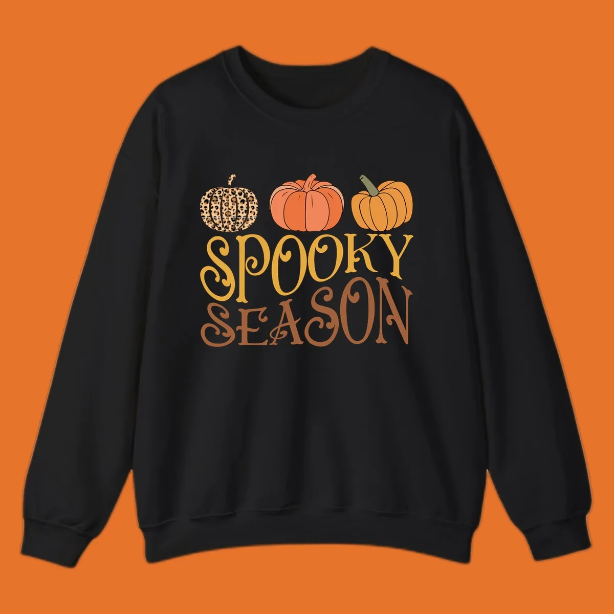 Spooky season pumpkins with leopard print and skull design, text: SPOOKY SEASON.