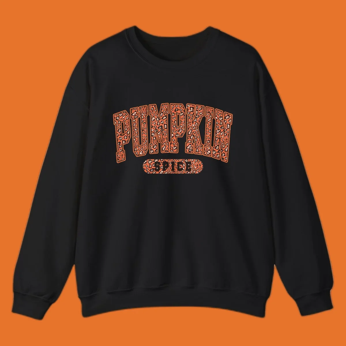 Pumpkin Spice text with leopard print pattern on dark outline, on black background.