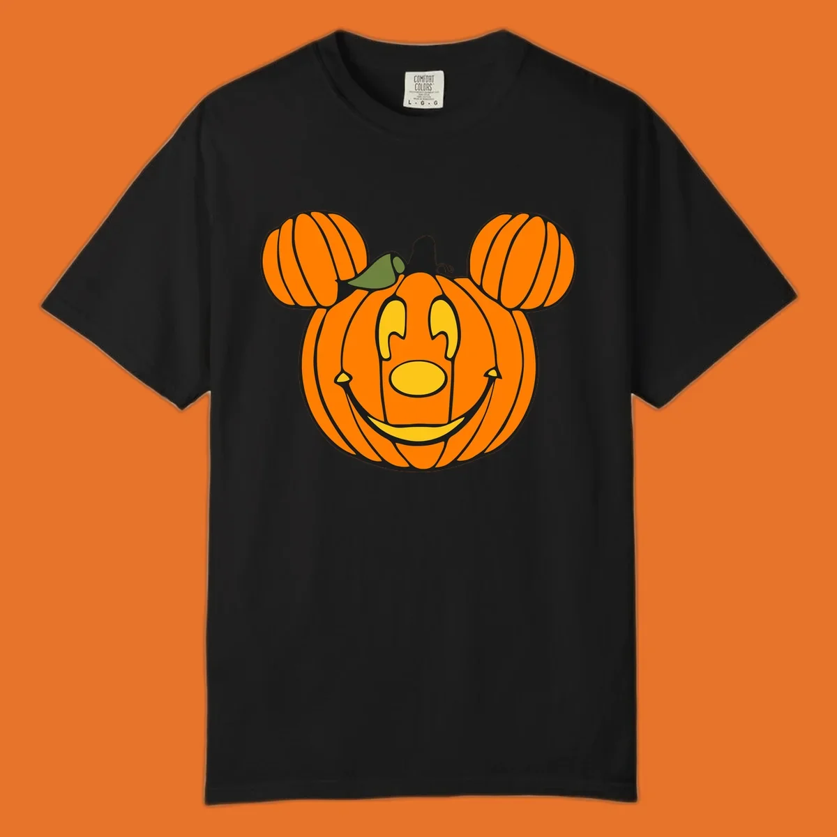 Mickey pumpkin halloween jack-o-lantern graphic with smiling face and ears.
