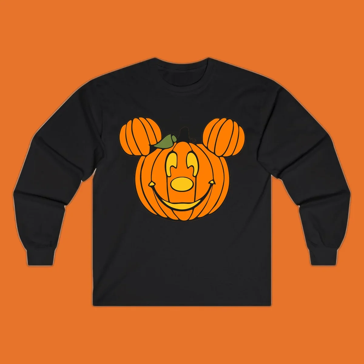 Mickey pumpkin halloween jack-o-lantern graphic with smiling face and ears.