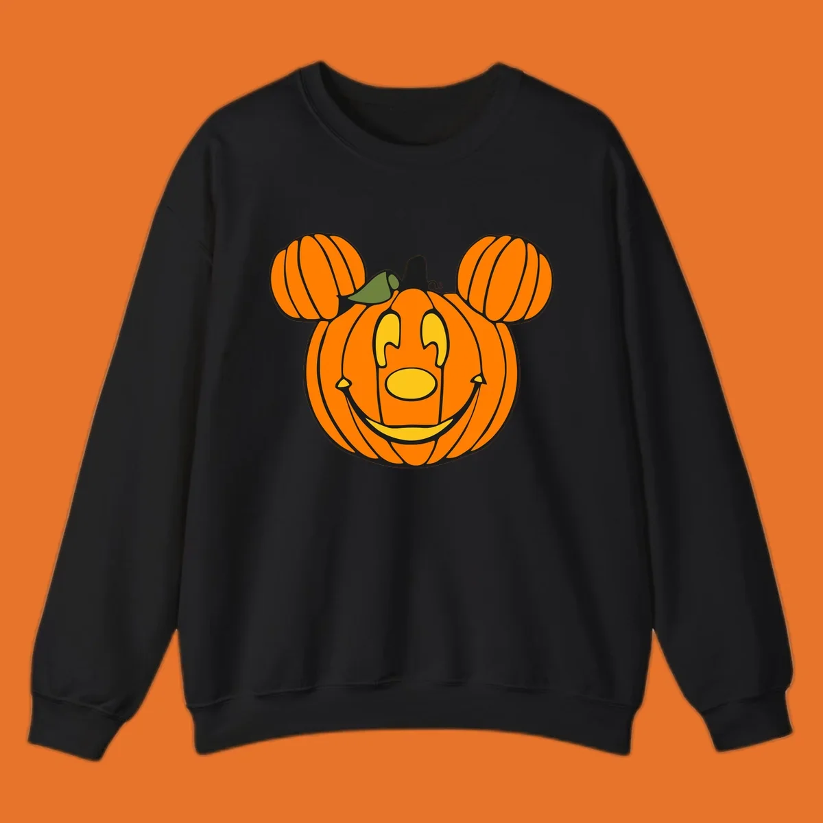 Mickey pumpkin halloween jack-o-lantern graphic with smiling face and ears.