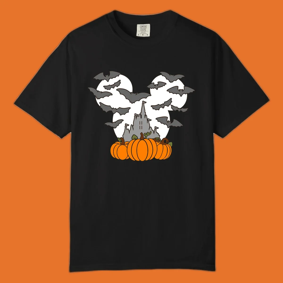 Halloween castle with bats and pumpkins against a Mickey Mouse ears moon graphic.