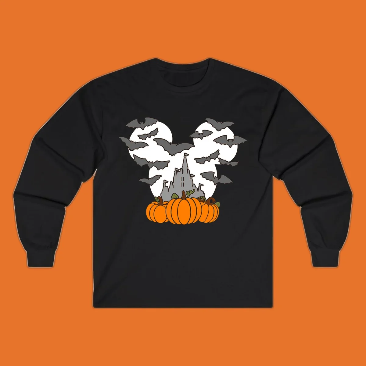 Halloween castle with bats and pumpkins against a Mickey Mouse ears moon graphic.