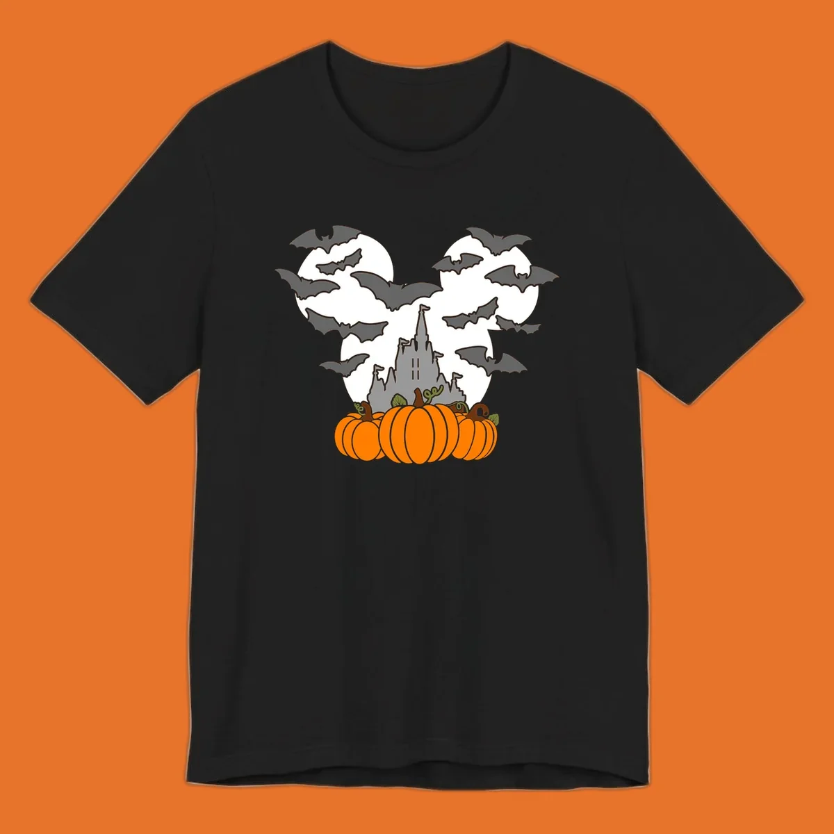 Halloween castle with bats and pumpkins against a Mickey Mouse ears moon graphic.