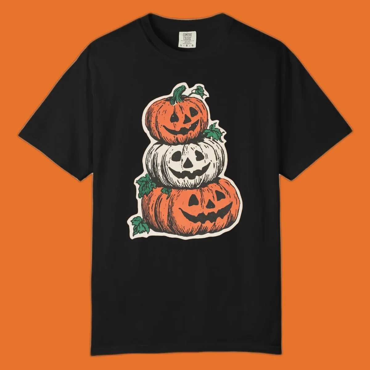 Stacked Halloween jack-o'-lanterns graphic with leaves for fall holiday shirts.