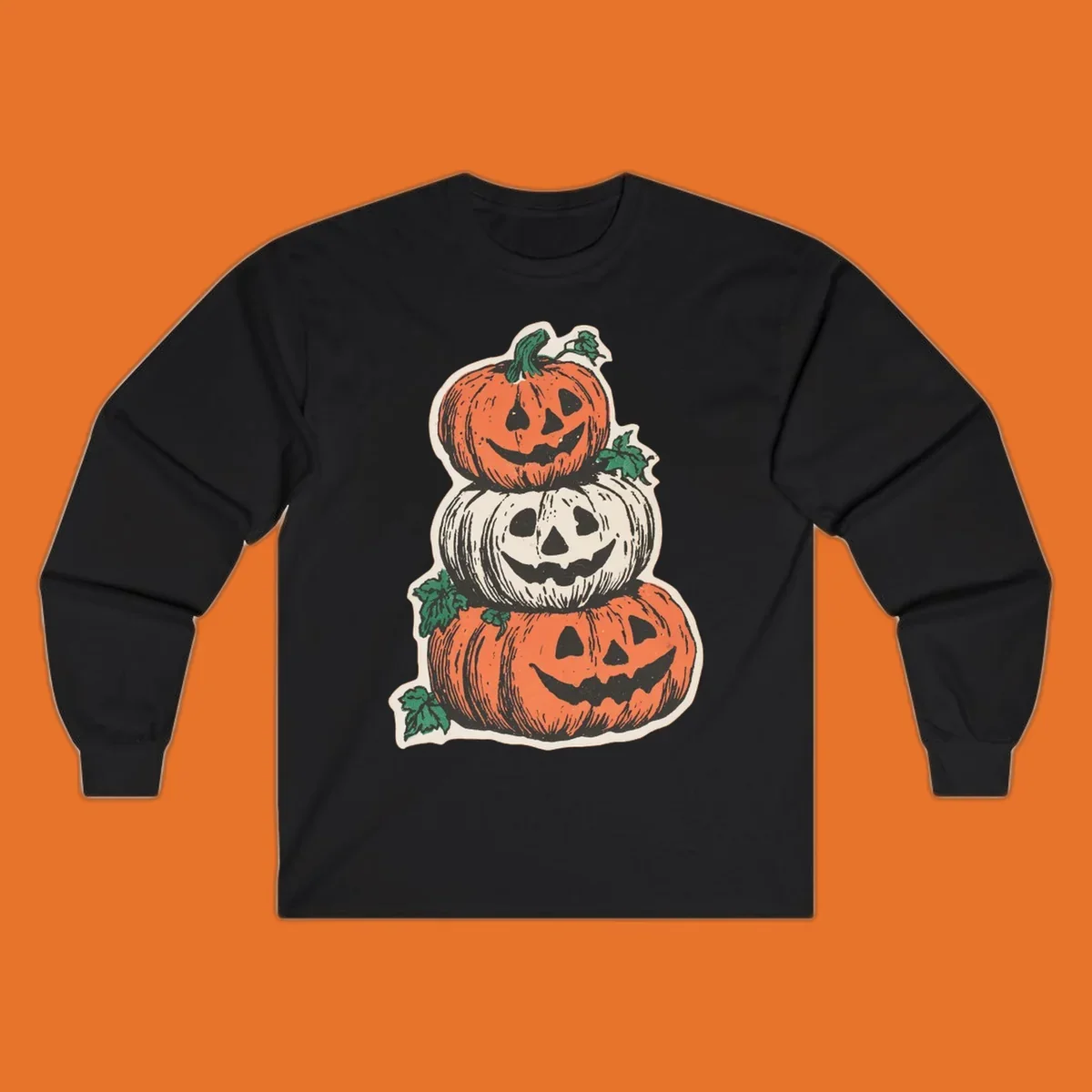 Stacked Halloween jack-o'-lanterns graphic with leaves for fall holiday shirts.