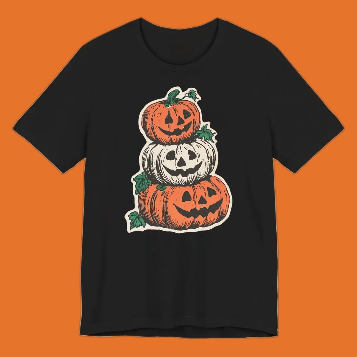 Stacked Halloween jack-o'-lanterns graphic with leaves for fall holiday shirts.