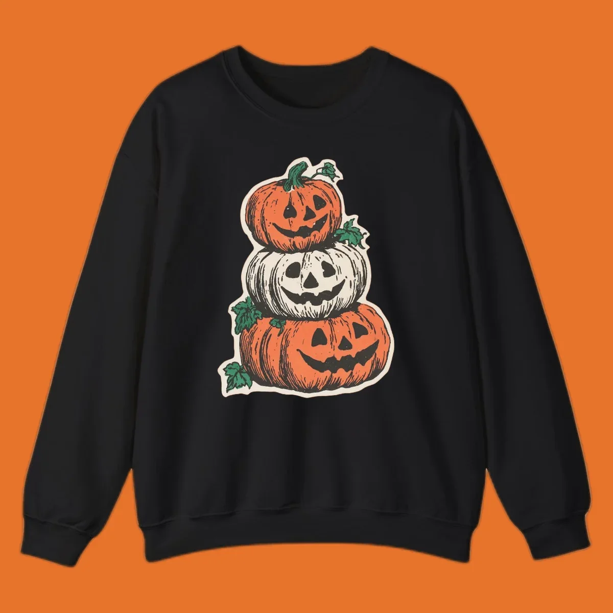 Stacked Halloween jack-o'-lanterns graphic with leaves for fall holiday shirts.