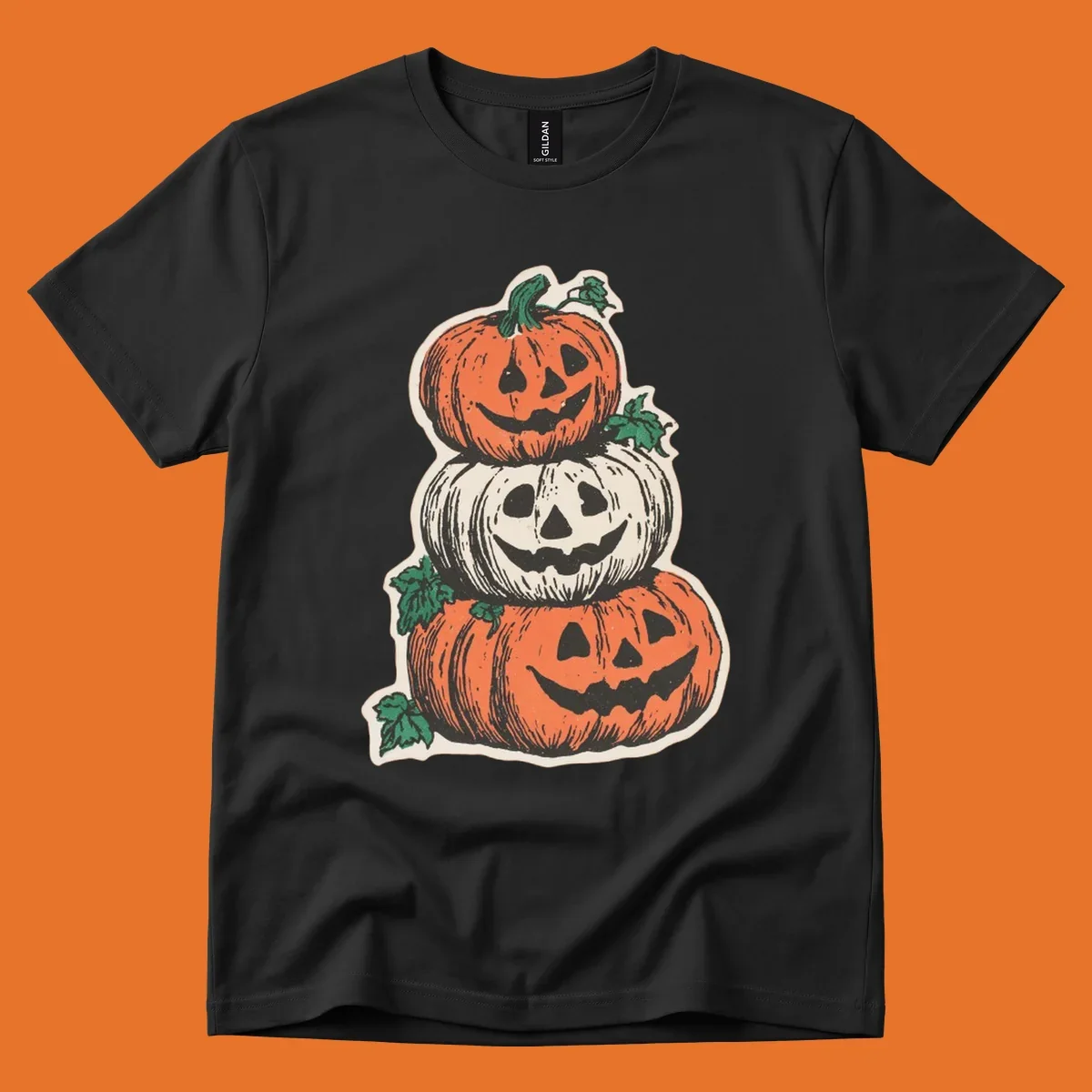 Stacked Halloween jack-o'-lanterns graphic with leaves for fall holiday shirts.