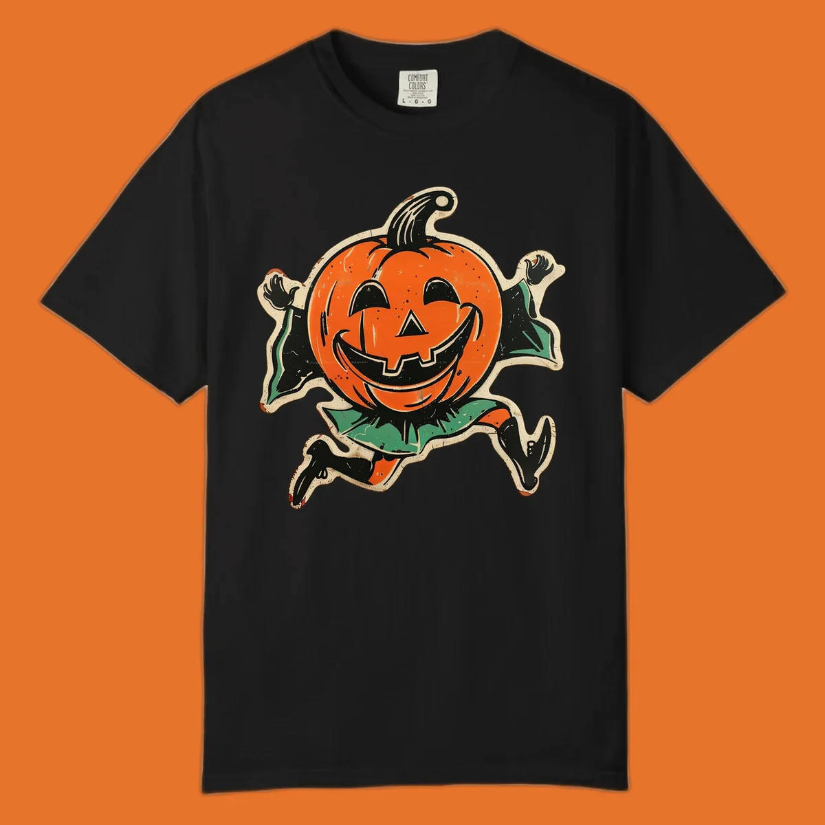 Vintage running jack-o'-lantern graphic with a big smile, black boots, and green leaves.