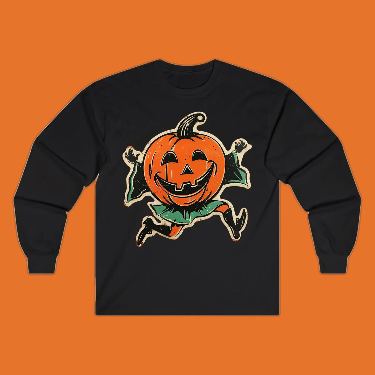 Vintage running jack-o'-lantern graphic with a big smile, black boots, and green leaves.