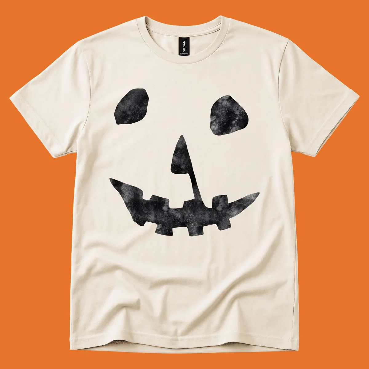 Spooky jack o lantern face graphic with distressed texture for Halloween.