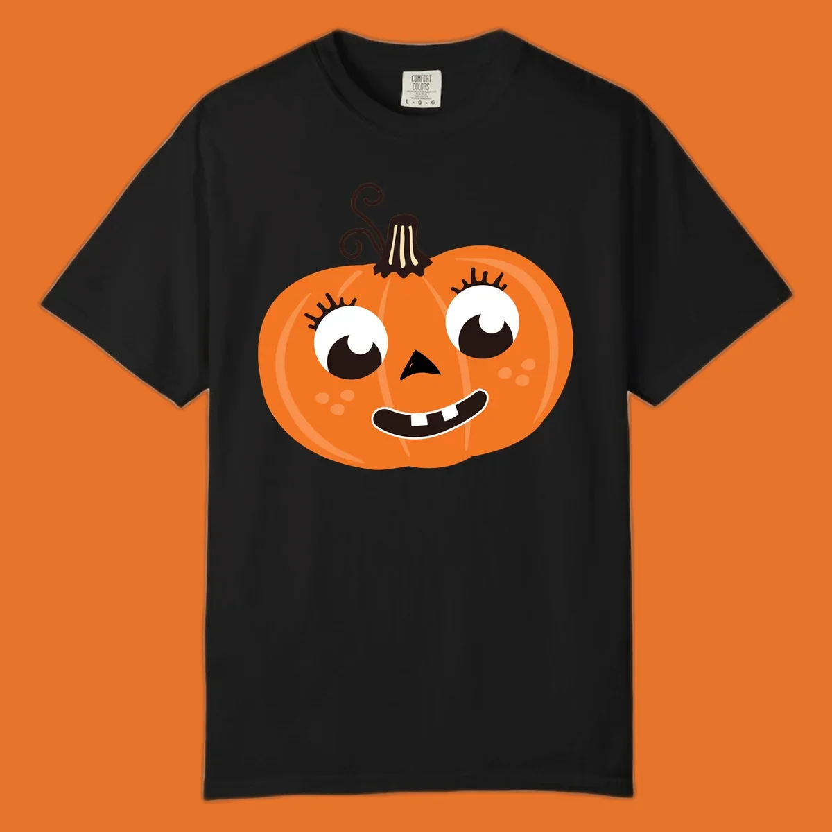 Cute halloween pumpkin face graphic with big eyes and a smile.