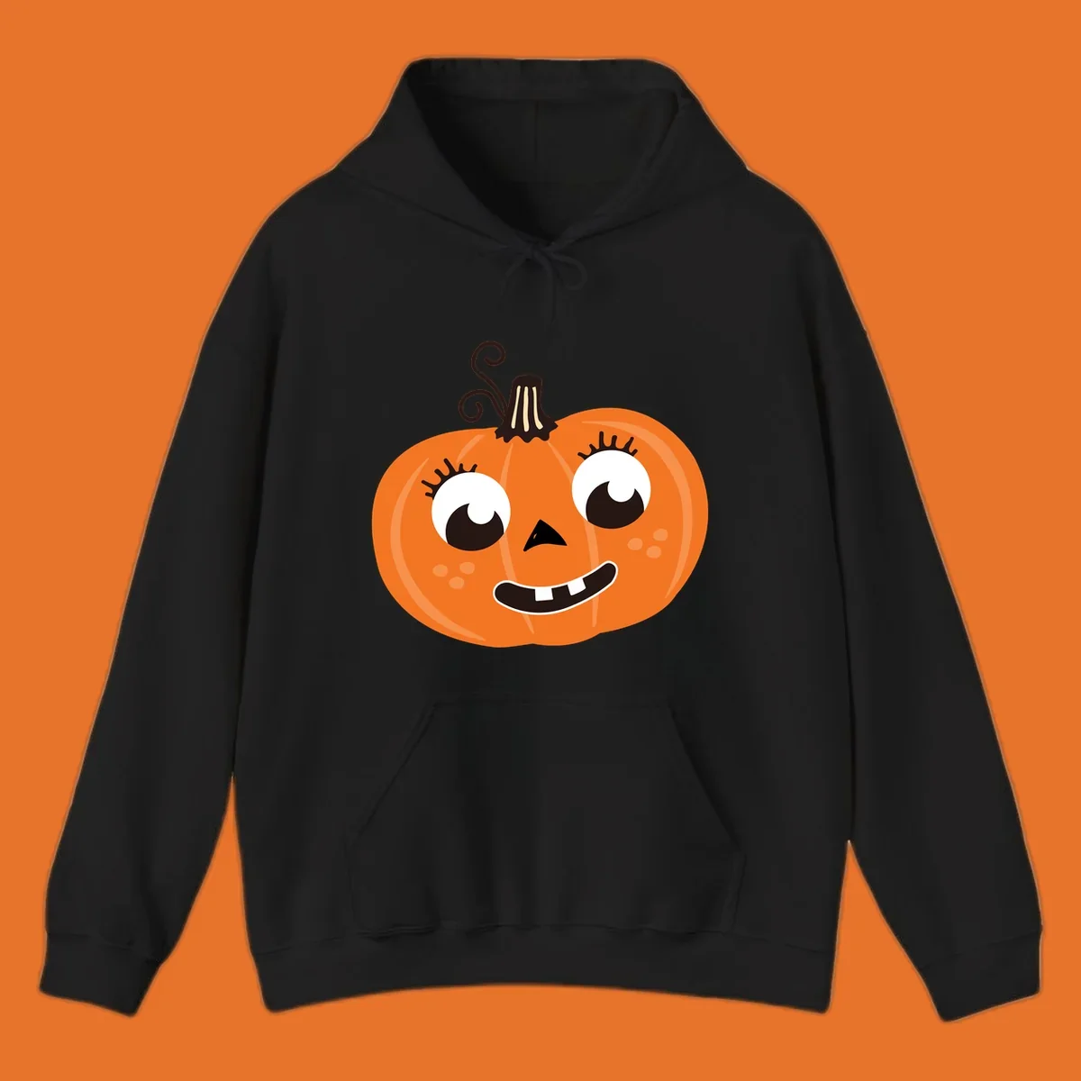Cute halloween pumpkin face graphic with big eyes and a smile.