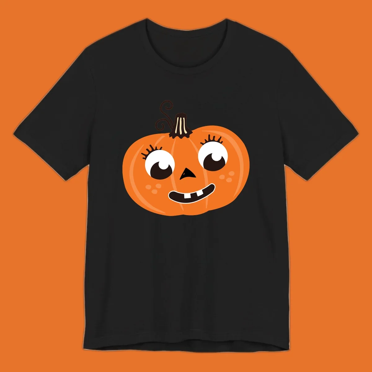 Cute halloween pumpkin face graphic with big eyes and a smile.